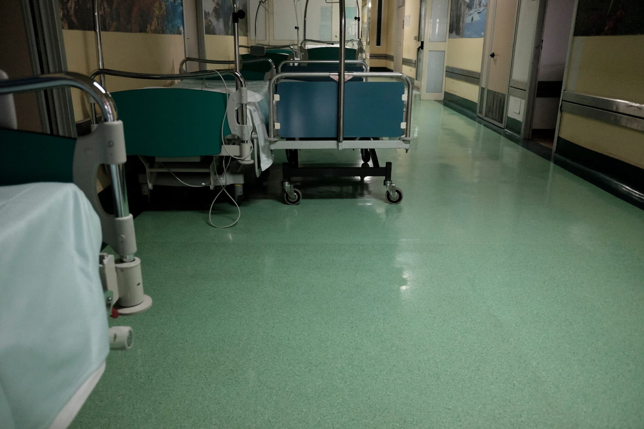 trolleys in a corridor of an overcrowded hospital