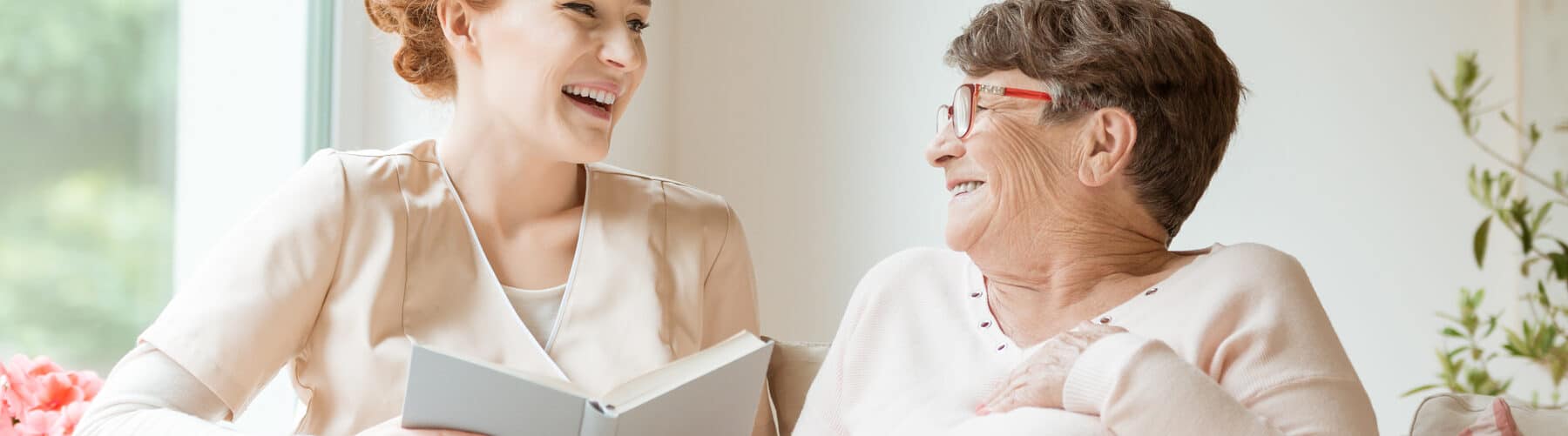 carer and patient sharing a laugh together